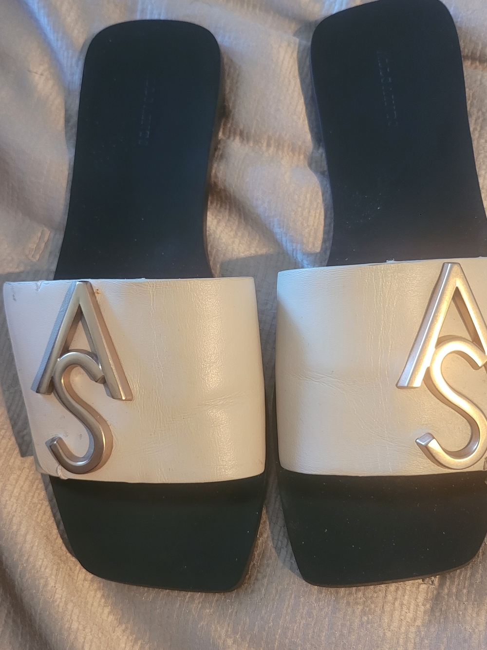 All Saints Cream and Black Slide Sandals with Metallic Logo